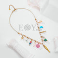 Collar con pez alargado y charms marinos