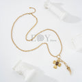 Collar Cruz Dorada con Colmillo