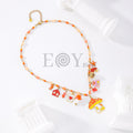 Collar naranja con setas