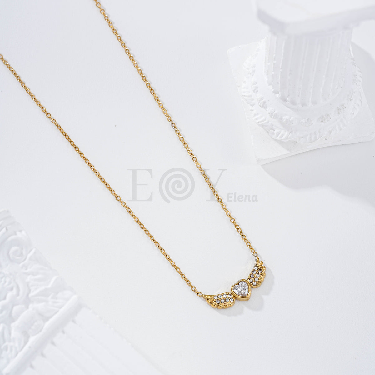 Collar corazón alas circonitas acero