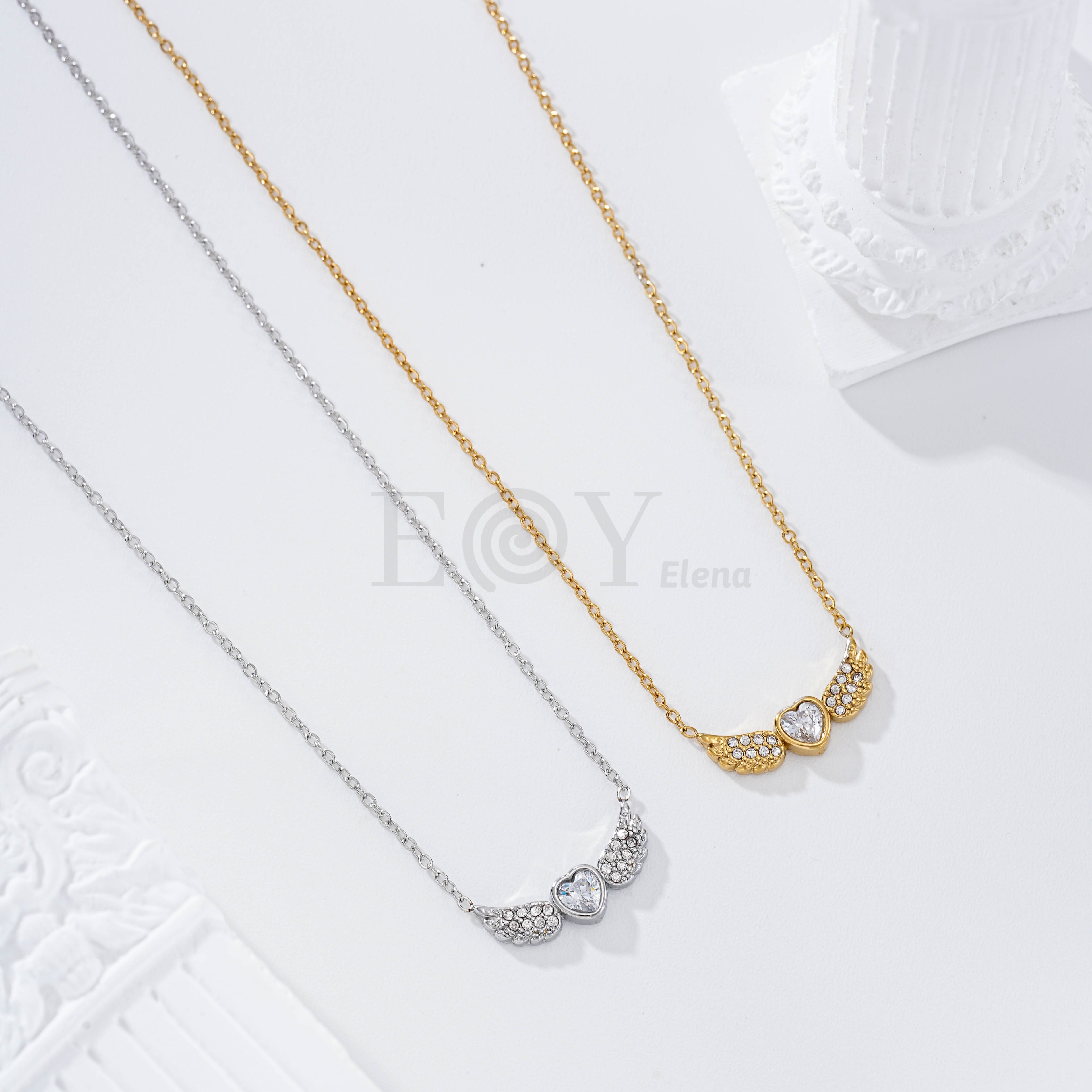 Collar corazón alas circonitas acero