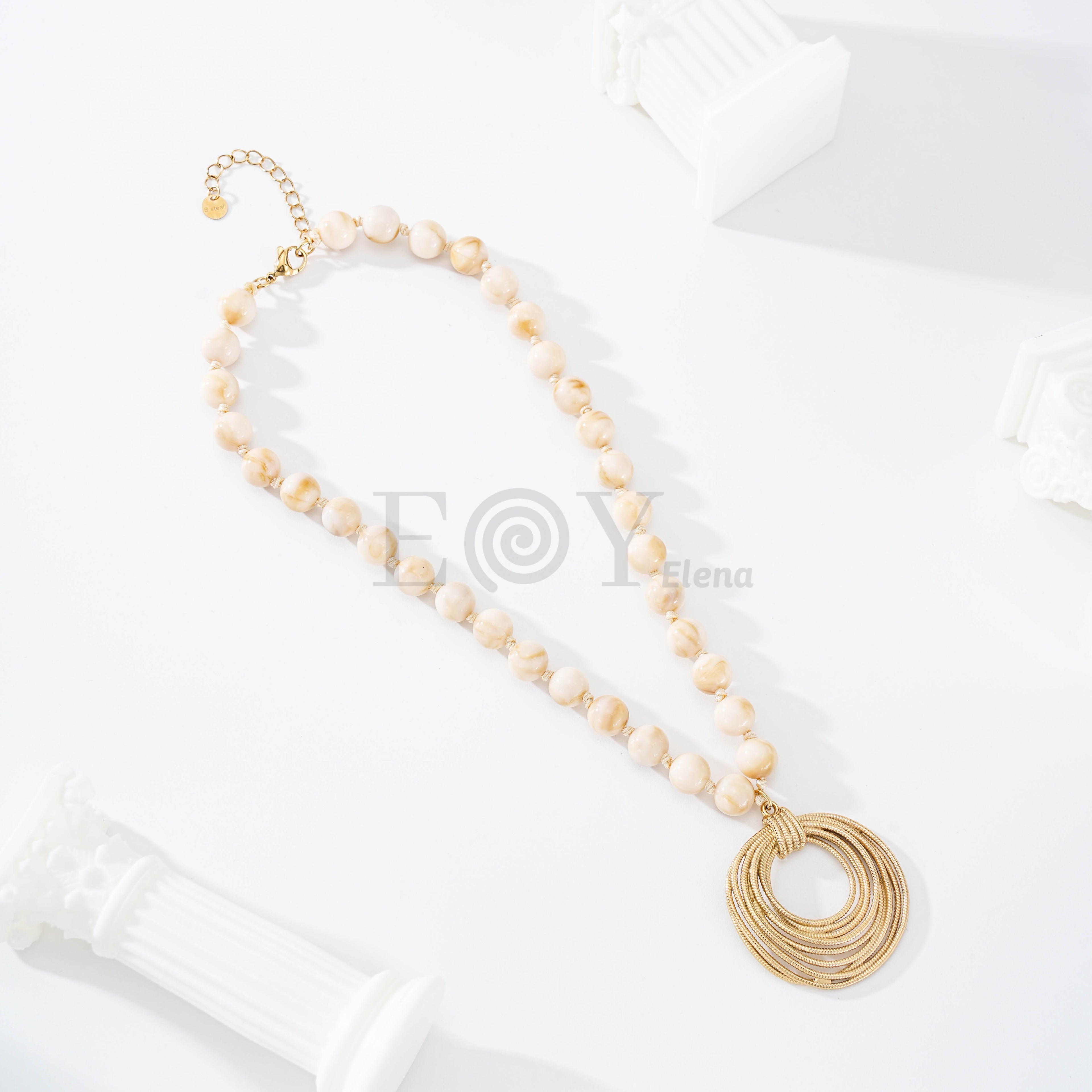 Collar piedras beige y aros hilos