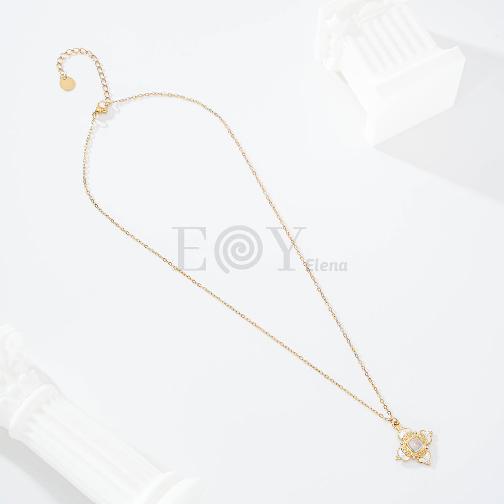Collar cruz con piedra
