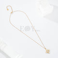 Collar cruz con piedra