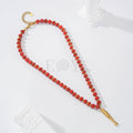 Collar bolas rojas con pez acero
