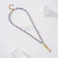 Collar bolas cerámica con pez relieve acero