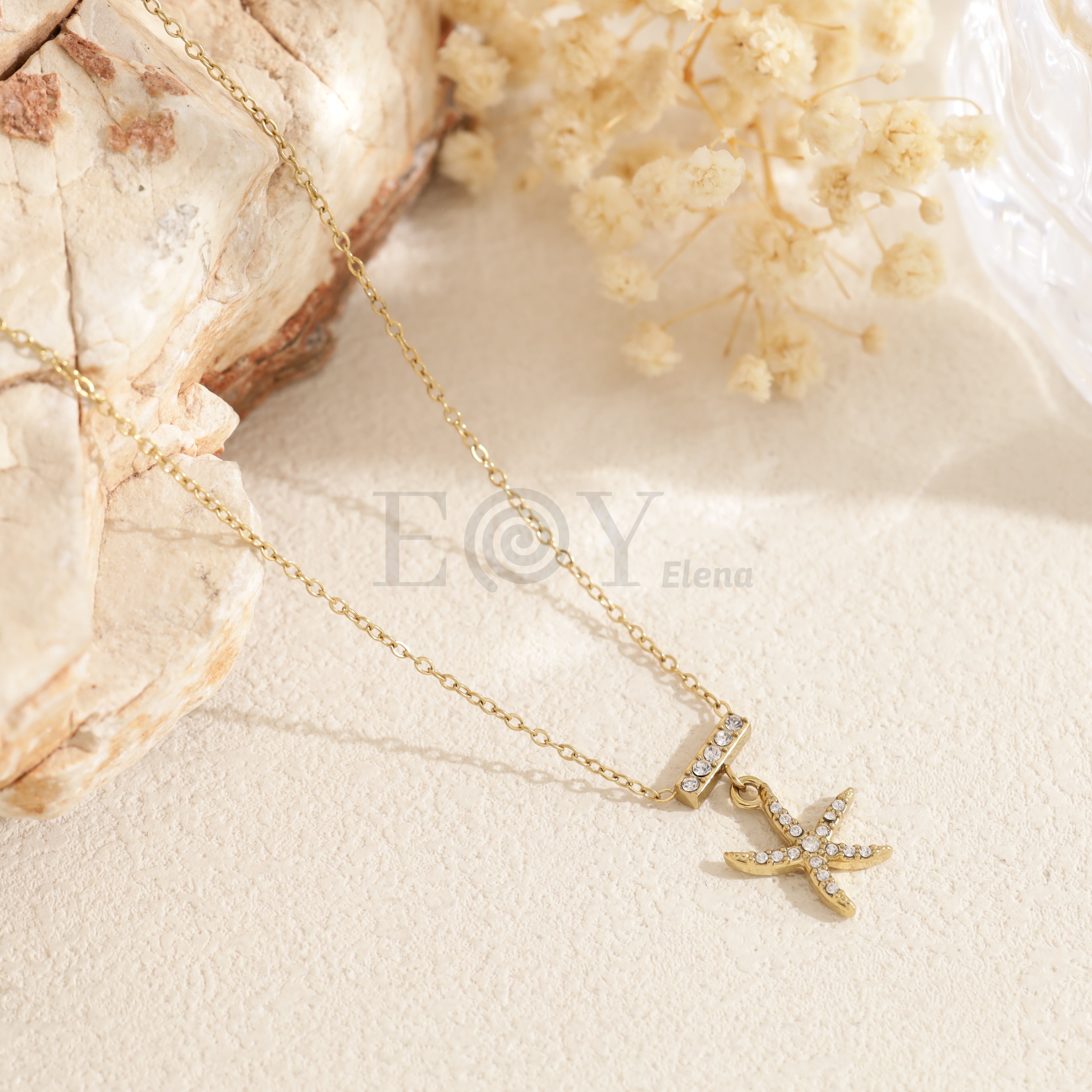 Collar barra circonitas y estrella mar acero