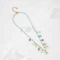 Collar de bolitas turquesa con charms marinos