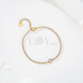 Pulsera de circonitas con chapa central