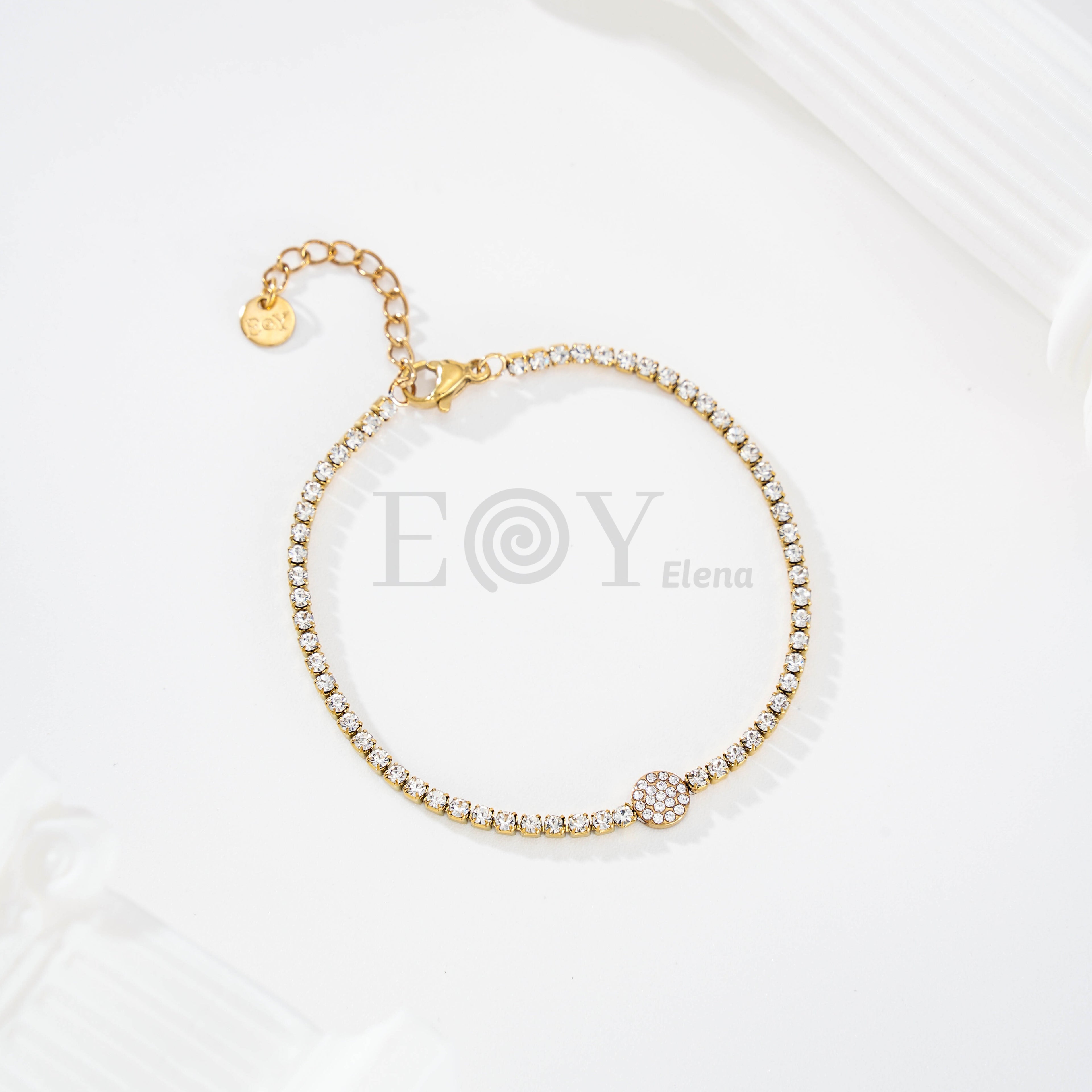 Pulsera de circonitas con chapa central