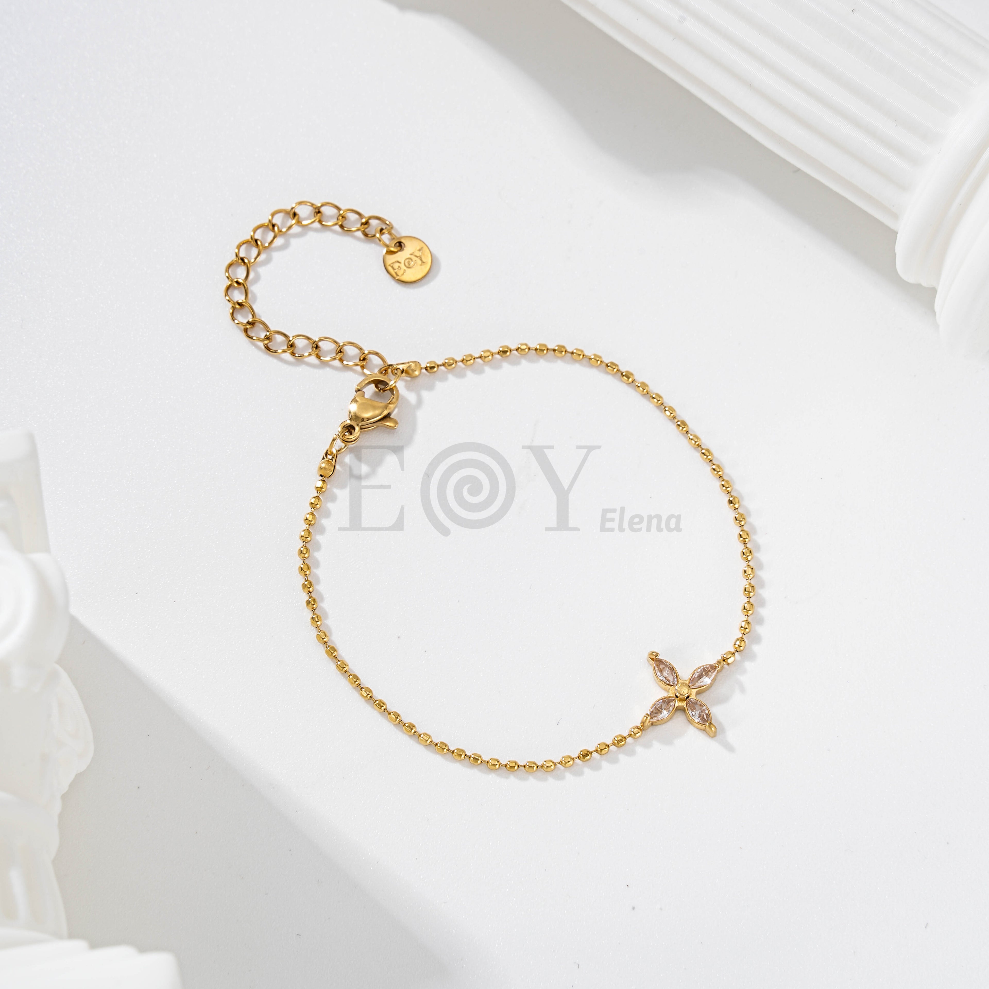 Pulsera de bolas con flor de circonitas
