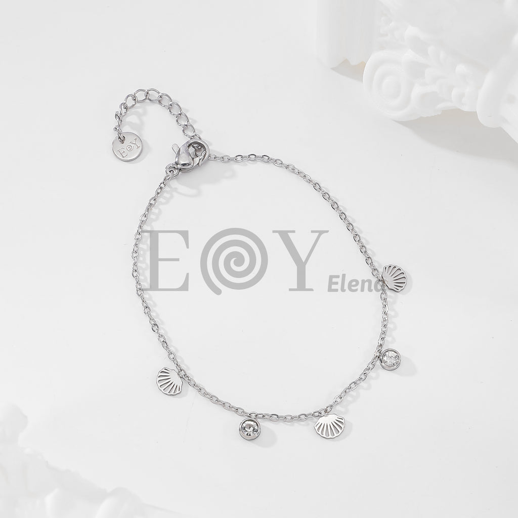 Pulsera de cadena con conchas marinas y circonitas