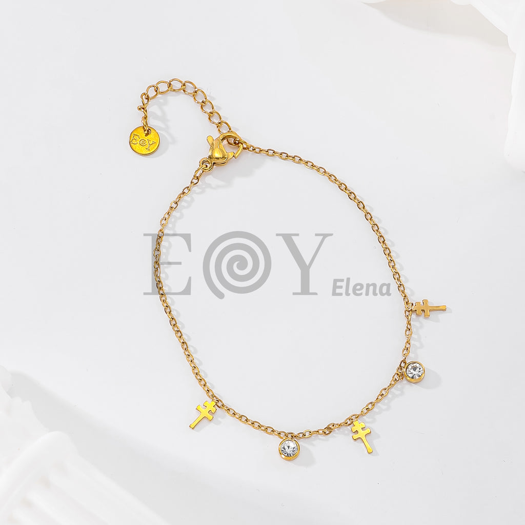 Pulsera de cadena con cruces colgantes y circonitas