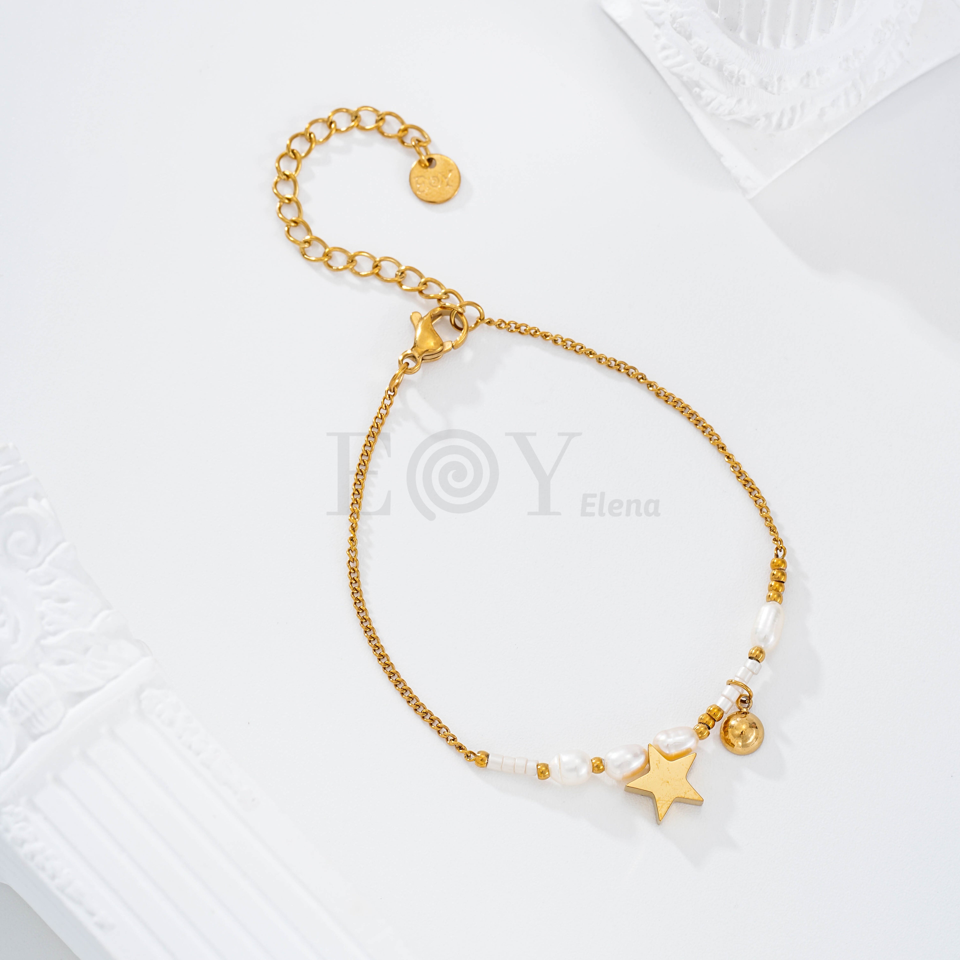 Pulsera con perlas y chapa estrella