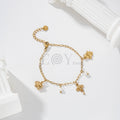 Pulsera de cadena dorada con colgantes de animales y perlas