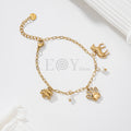 Pulsera de cadena dorada con colgantes de gato, elefante, huella y perlas