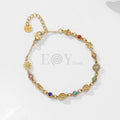 Pulsera de símbolos y circonitas colores