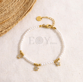 Pulsera perlas con chapas estrella