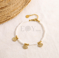 Pulsera perlas con conchas circonitas