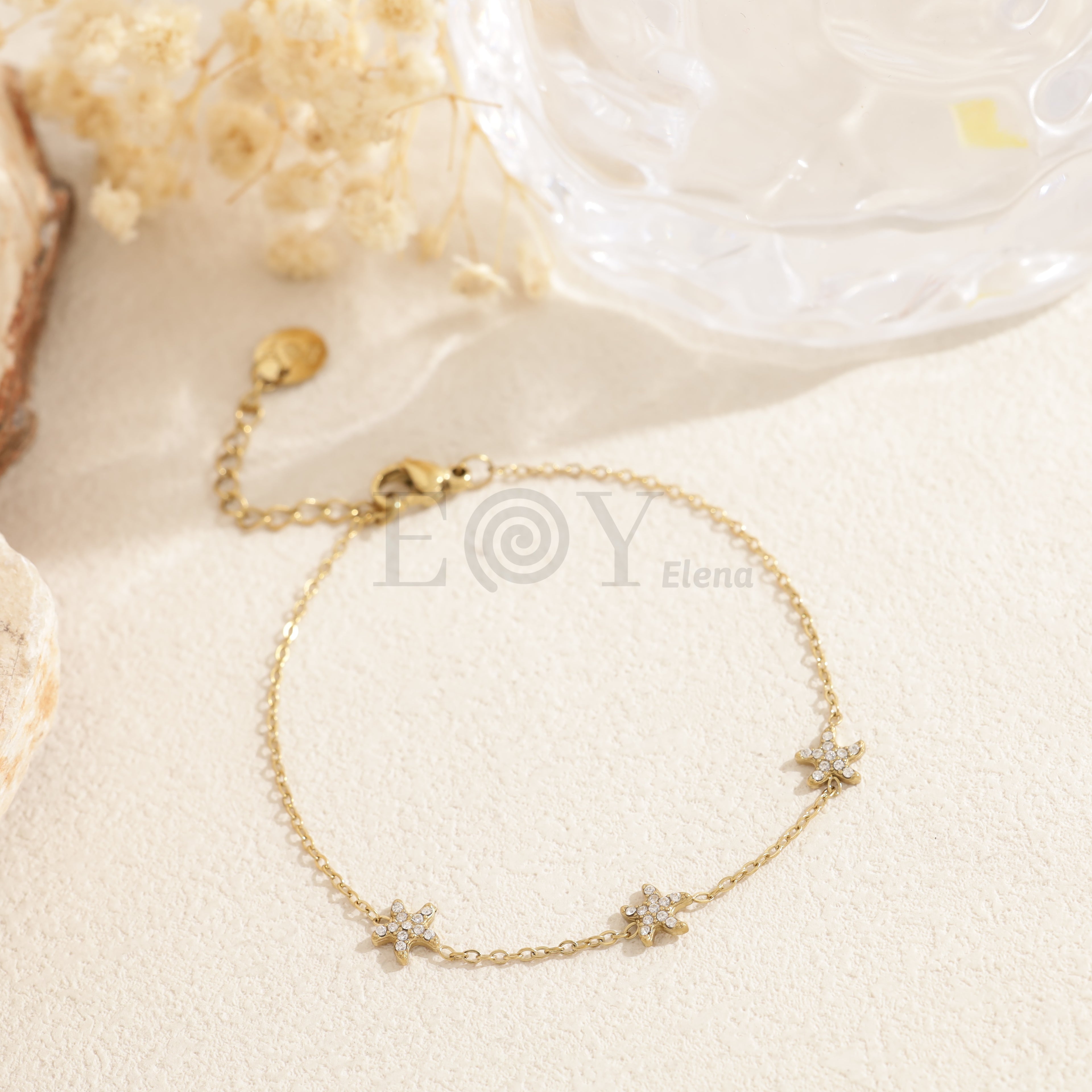 Pulsera triple estrella de mar circonitas acero