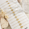 Pack de pulseras finas con flores doradas