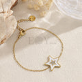 Pulsera estrella blanca dorada