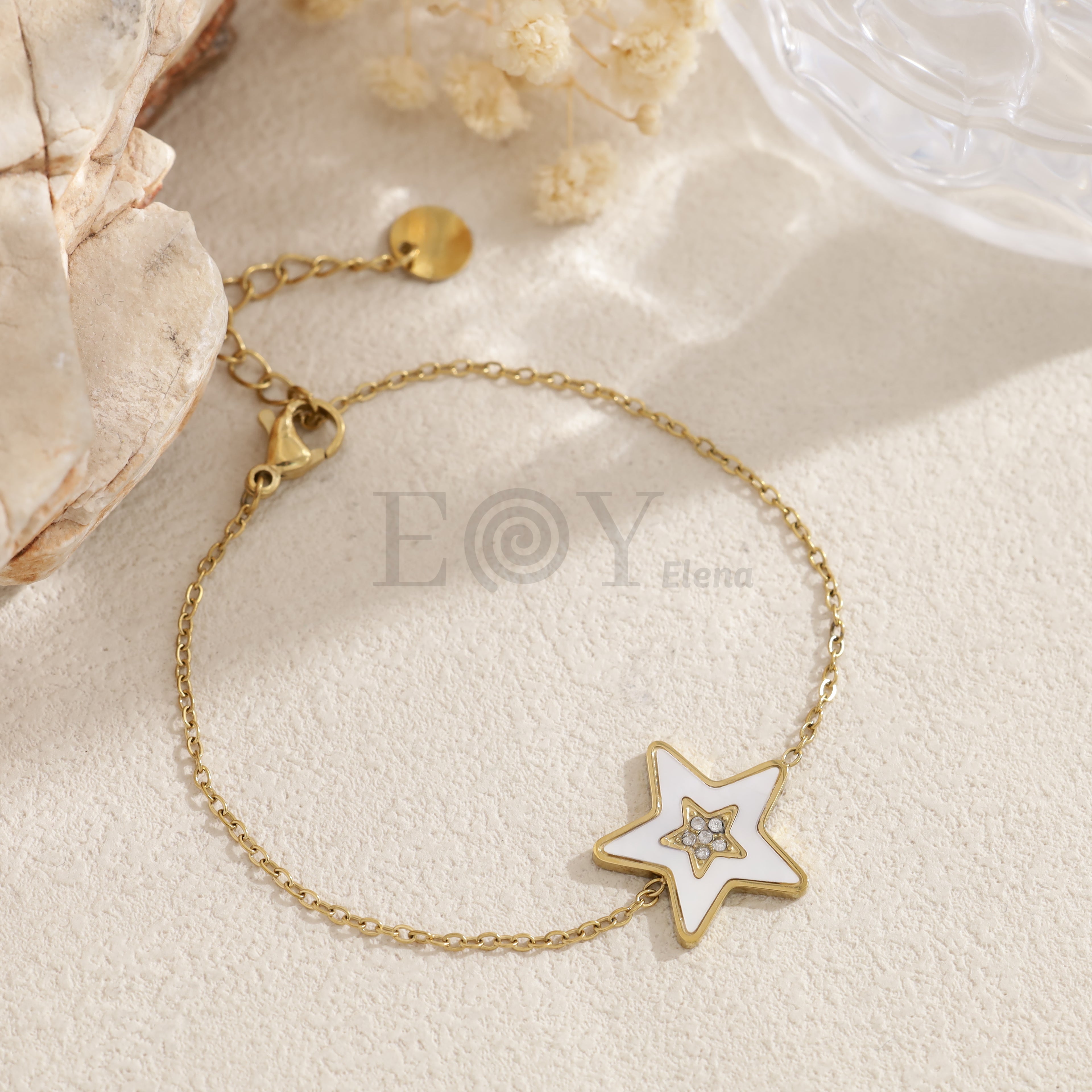 Pulsera estrella blanca dorada