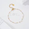 Pulsera bolas blancas y doradas acero