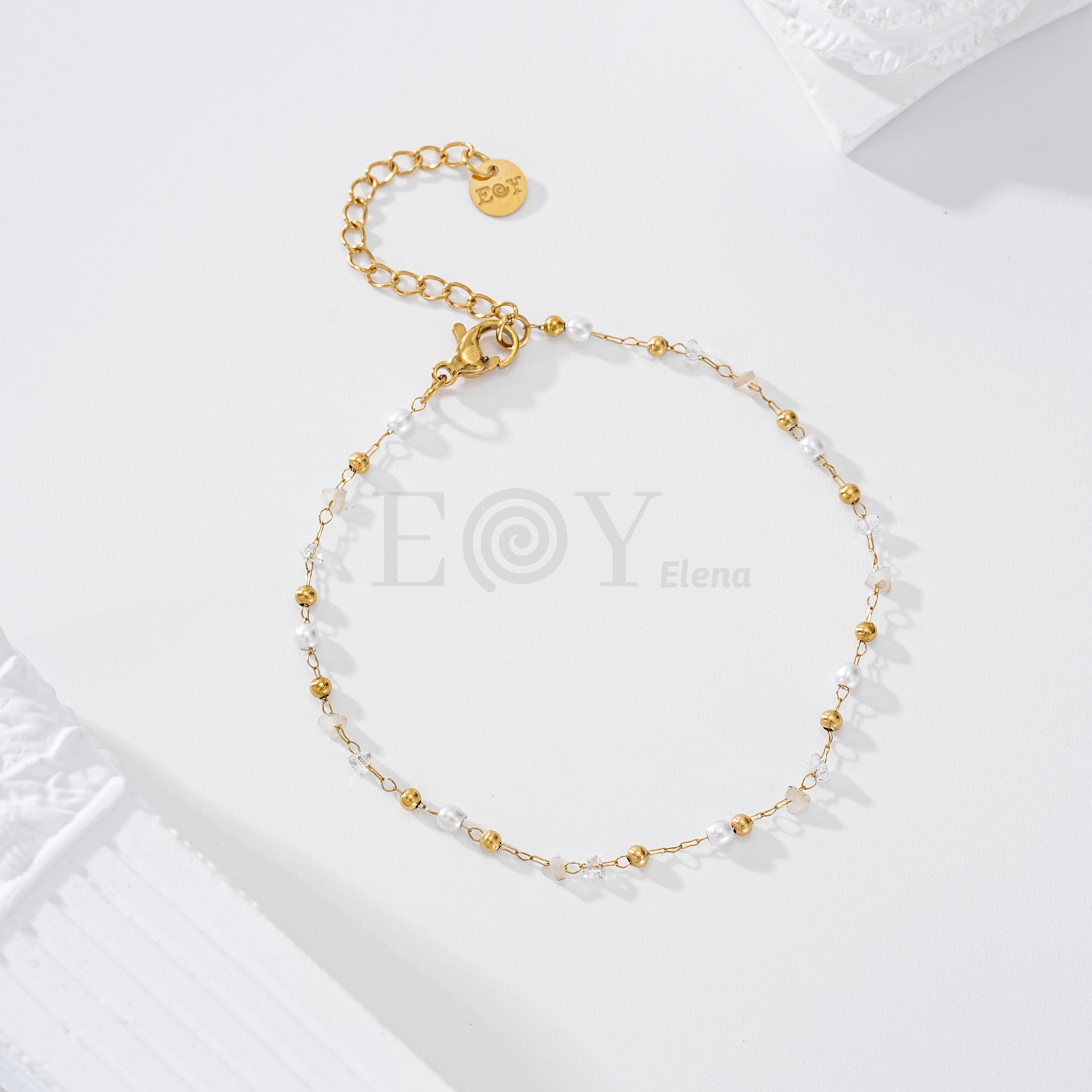 Pulsera bolas blancas y doradas acero