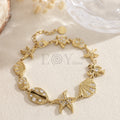 Pulsera marina dorada con charms
