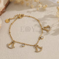 Pulsera de cadena dorada con colgantes de vírgenes y circonitas