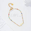 Pulsera bolitas color con cruz central acero