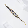 Pulsera con piedras redondas oscuras