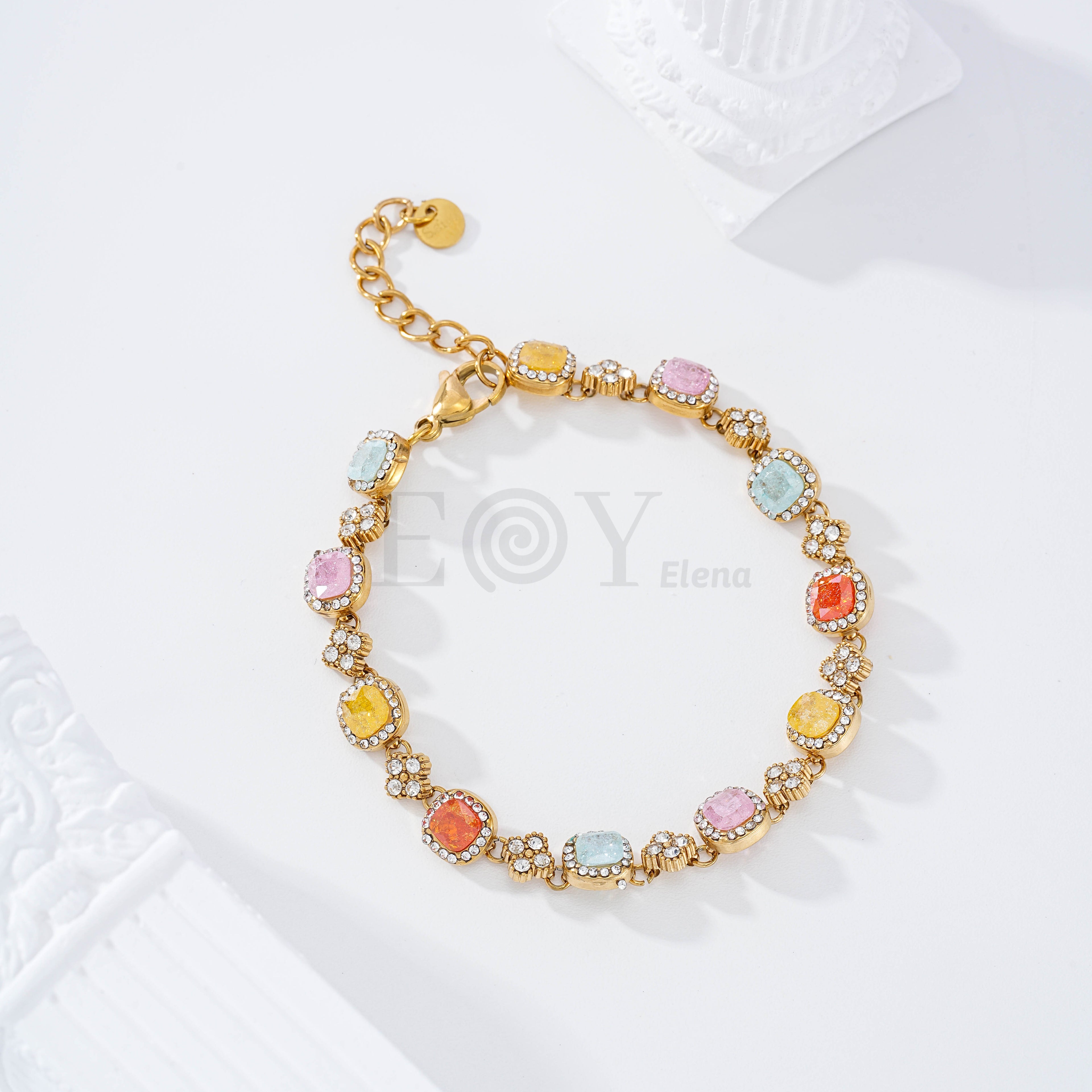 Pulsera con piedras cuadradas color y flor circonita