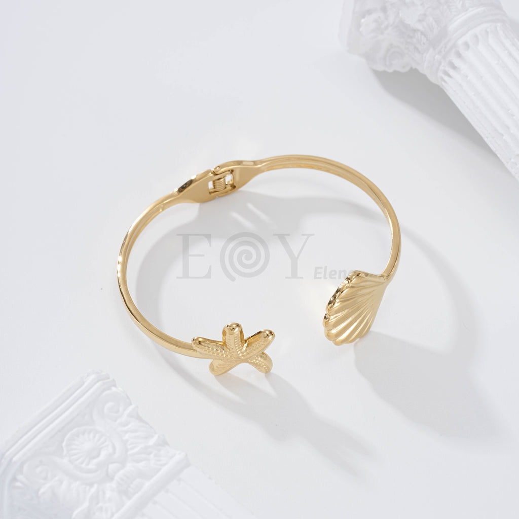 Brazalete estrella de mar y concha acero