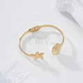 Brazalete estrella de mar y concha acero