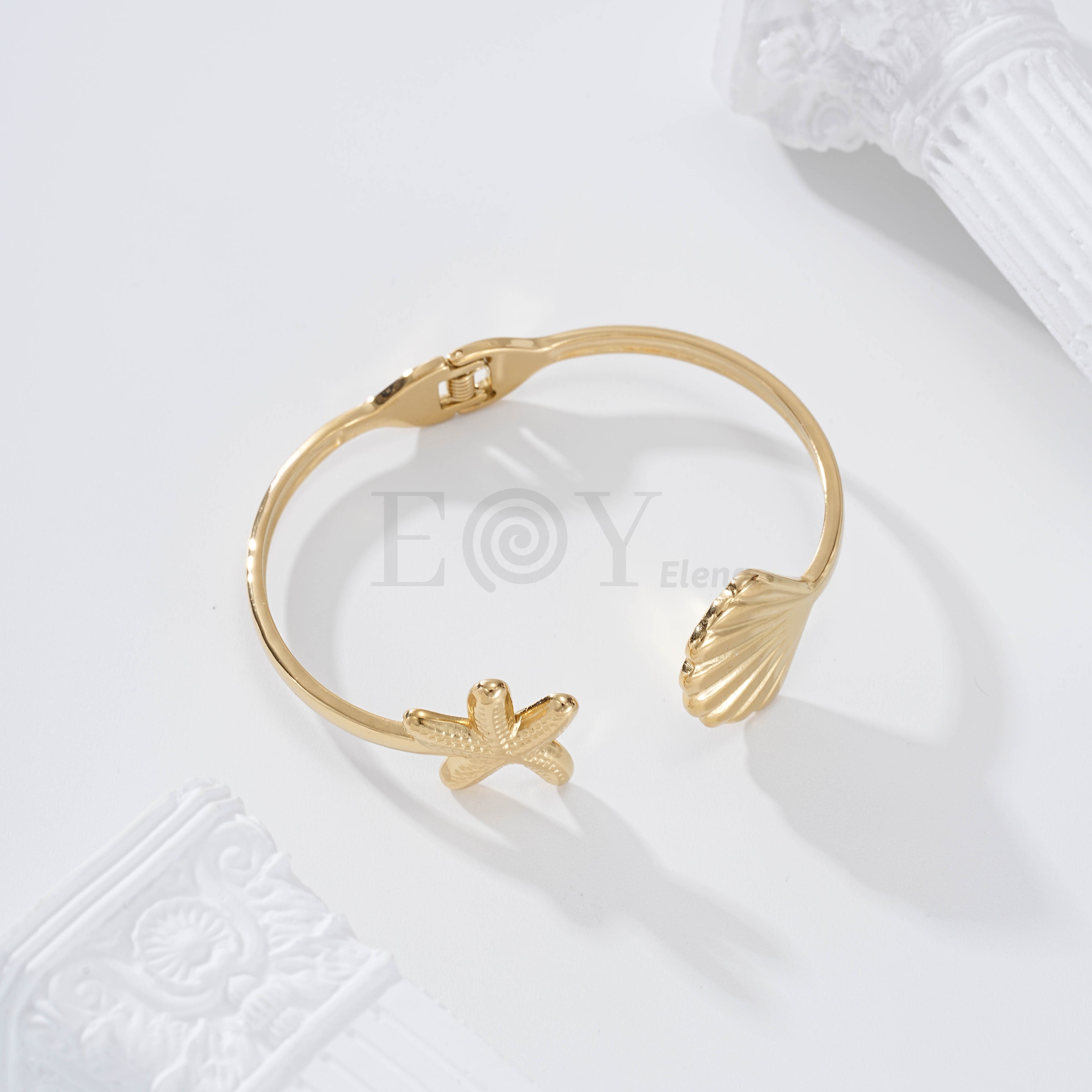 Brazalete estrella de mar y concha acero