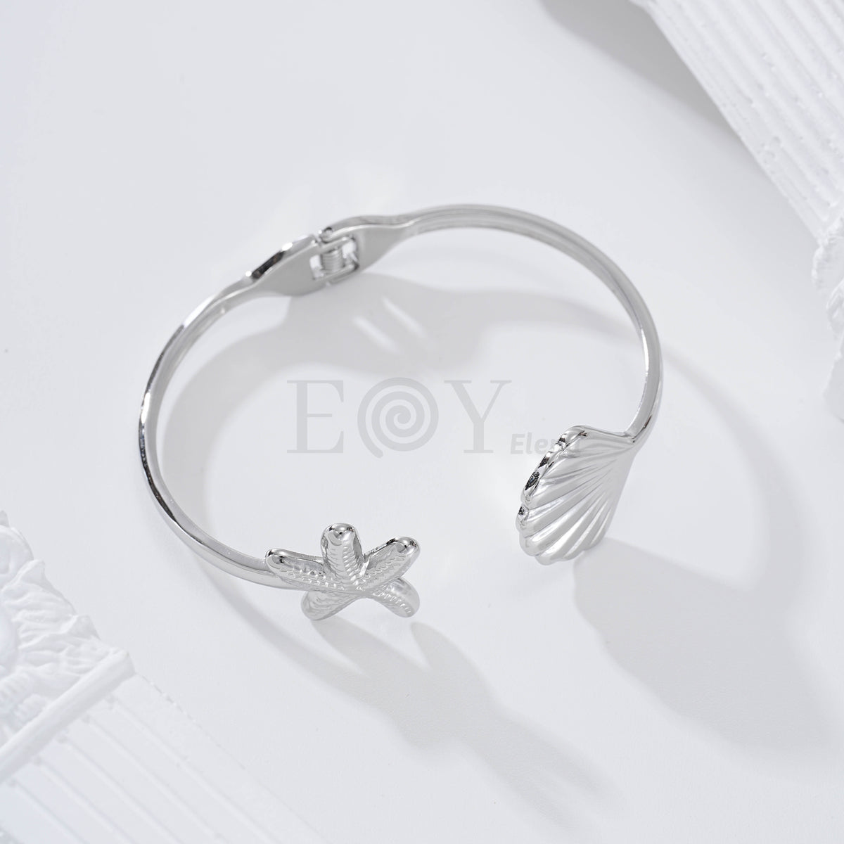 Brazalete estrella de mar y concha acero