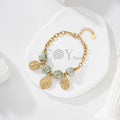 Pulsera de bolas y charms de vírgenes