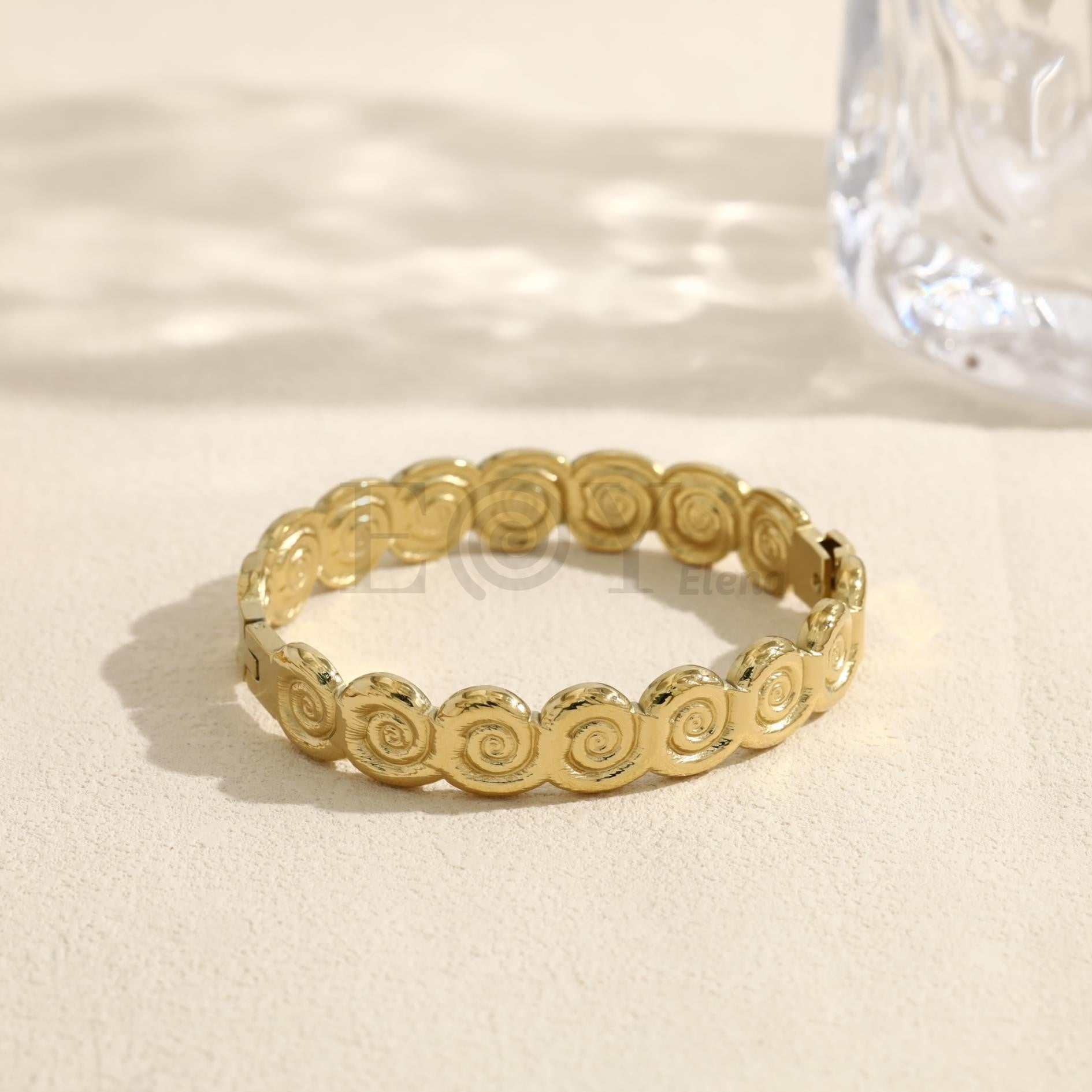 Brazalete con discos en espiral