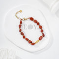 Pulseras de piedras con detalle dorado central