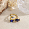 Anillo abierto dorado con piedras de colores