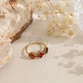 Anillo abierto dorado con circonitas de colores