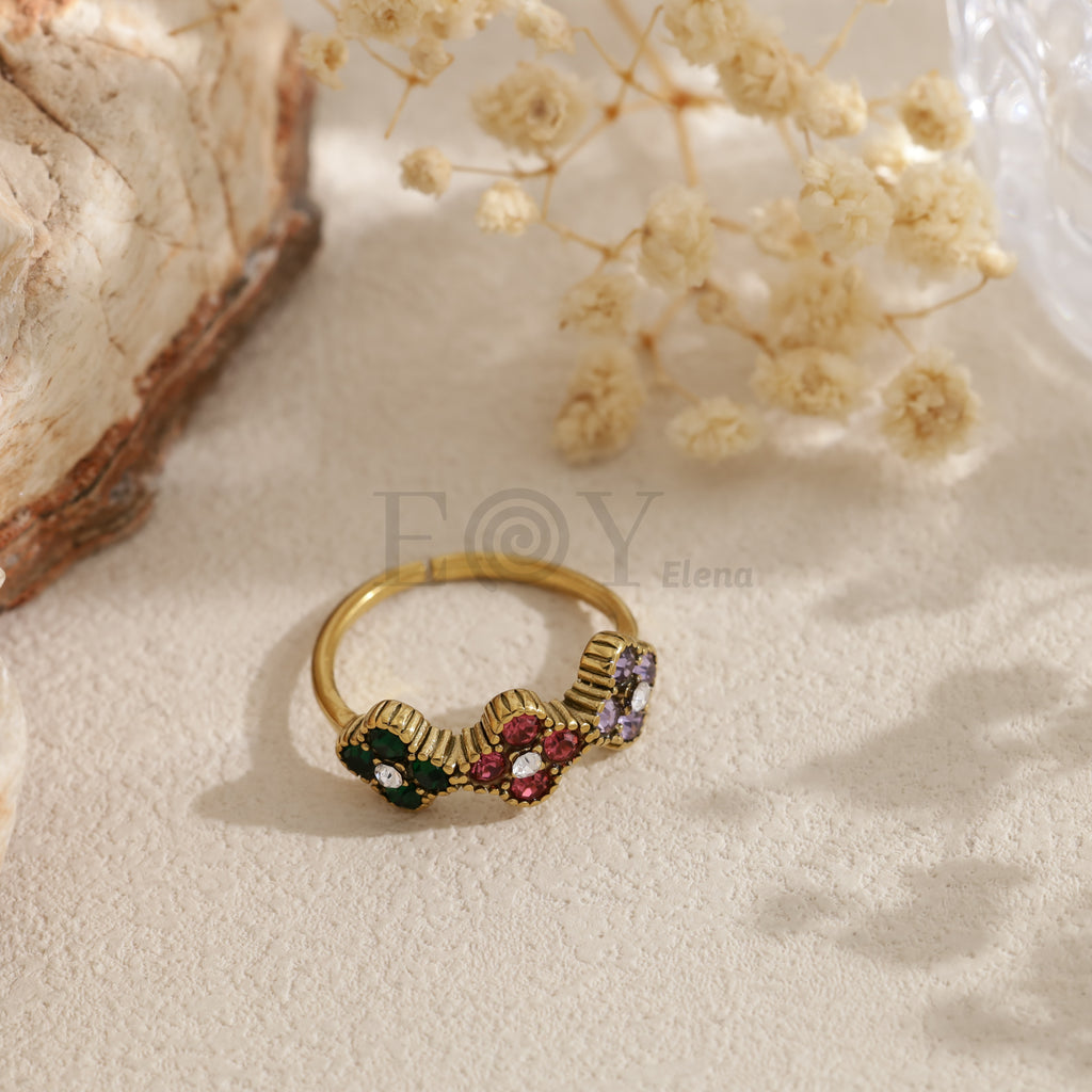 Anillo abierto dorado con circonitas de colores