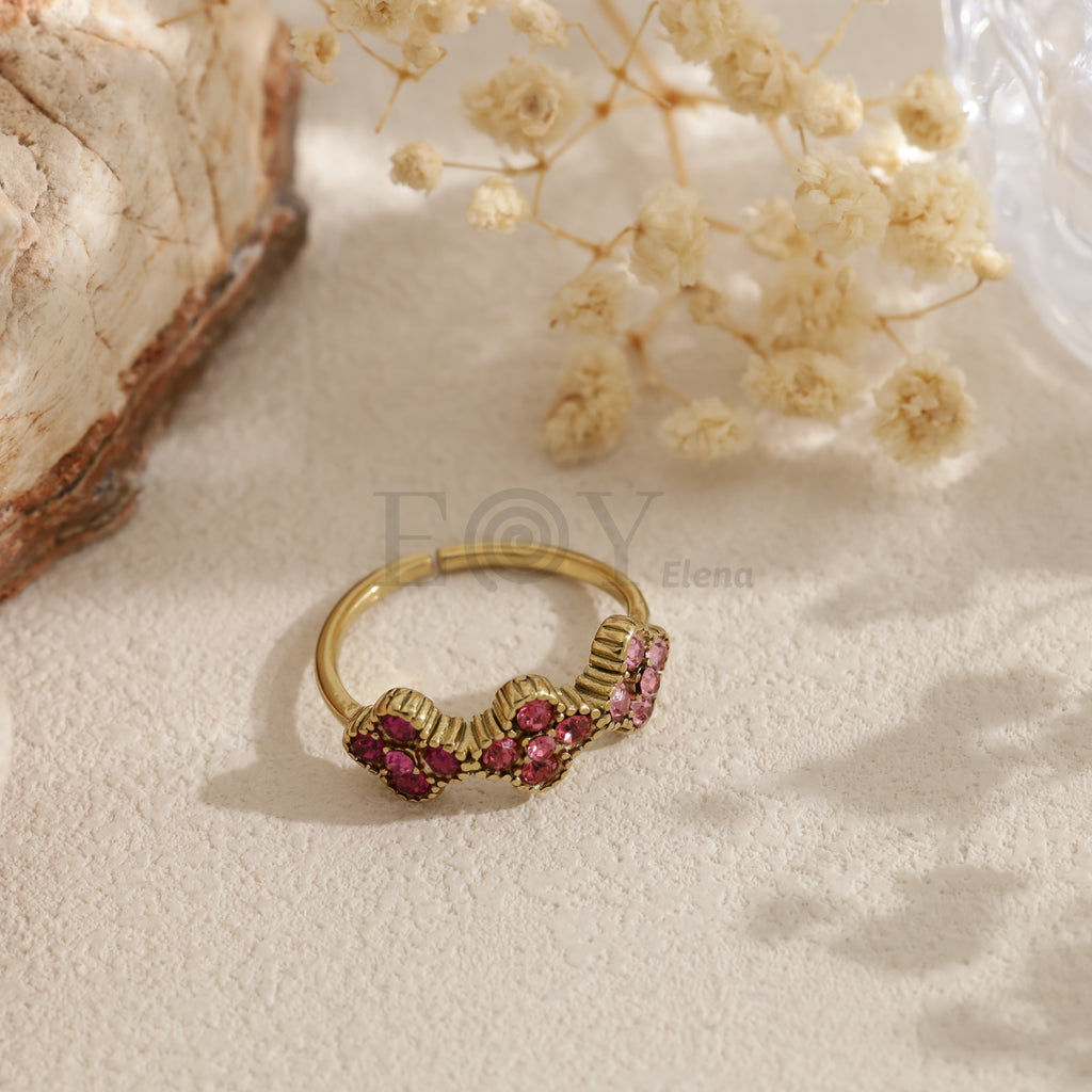 Anillo abierto dorado con circonitas de colores