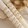 Pack 12 anillos con circonita acero